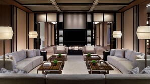 A modern living room with sofas, coffee tables, and a fireplace. - The Ritz-Carlton, Xi'an (Xi'an)