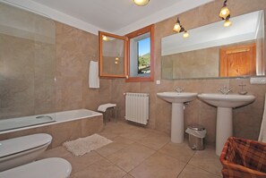 Bathtub, hair dryer, towels