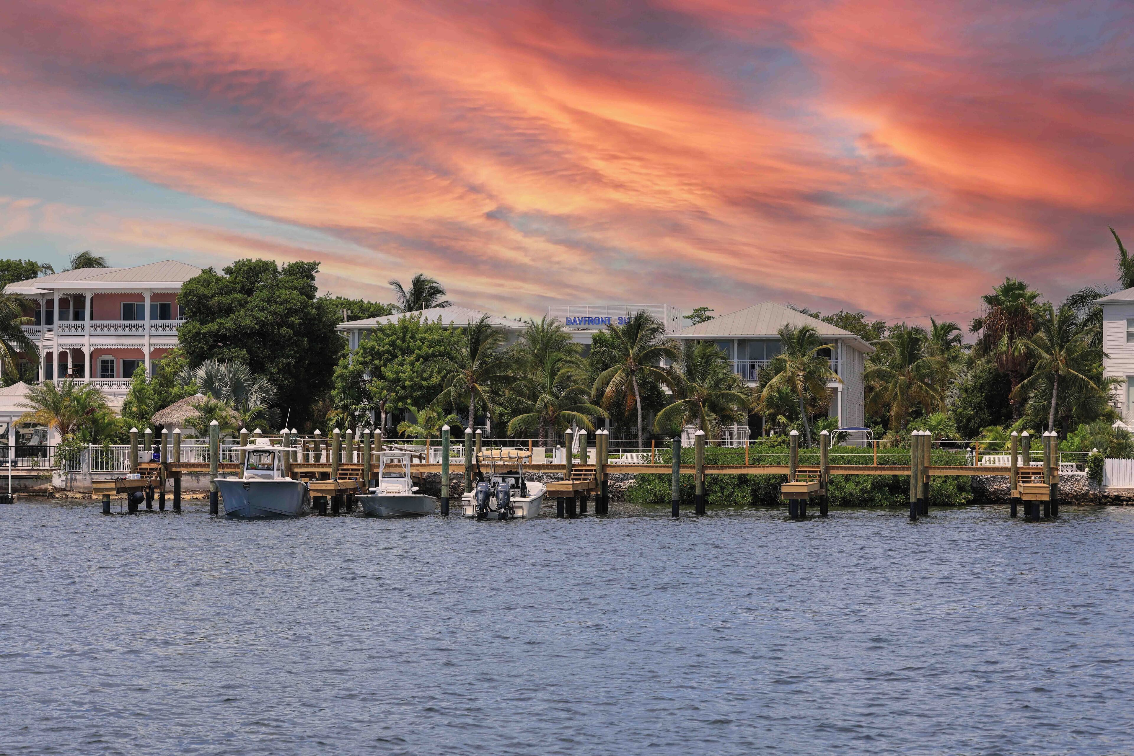 A waterfront property with a dock, boats, and a building with a sign reading "DAFFORD'S".