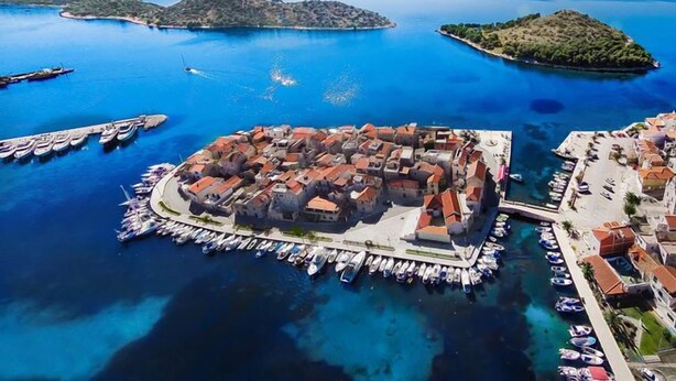 An aerial view of a coastal town with a central square, surrounded by water and small islands. - Vacation home East by Interhome (Vodice/Tribunj)