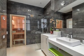 Bathtub, hair dryer, towels, soap