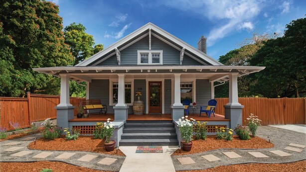 A two-story house with a porch, a front door, and a mailbox. - Historic 1910 Bungalow & Carriage House • Dog Friendly • 1 Block to Wine & Dine (McMinnville)