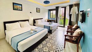 A hotel room with two beds, a desk, a chair, a balcony with a view, and a no-smoking sign. - Grand Holiday Villa (Da Nang)