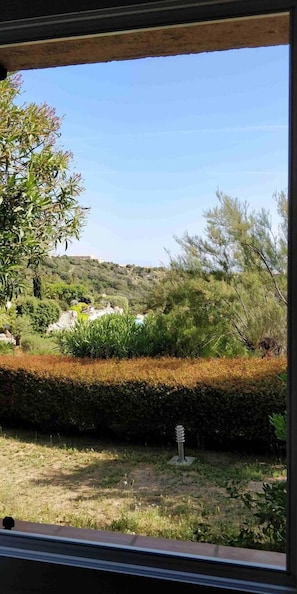 Guests can enjoy a serene view of the beautifully landscaped garden from the comfort of their room.