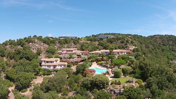 A hillside property with multiple villas, a swimming pool, and lush greenery. - Mini-villa No. 10 - 2/4 people (Porto-Vecchio)
