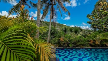 Outdoor pool, open 6:00 AM to 10:00 PM, pool umbrellas, pool loungers