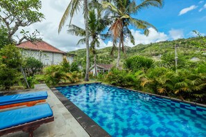 Outdoor pool, open 6:00 AM to 10:00 PM, pool umbrellas, sun loungers