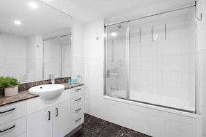 Combined shower/bathtub, hair dryer, towels, soap