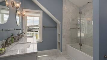Combined shower/tub, hair dryer, towels, soap