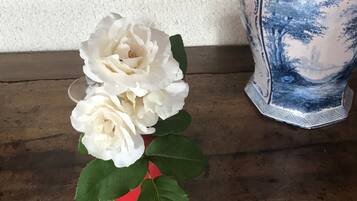 A vase with a blue and white floral pattern on a wooden surface.