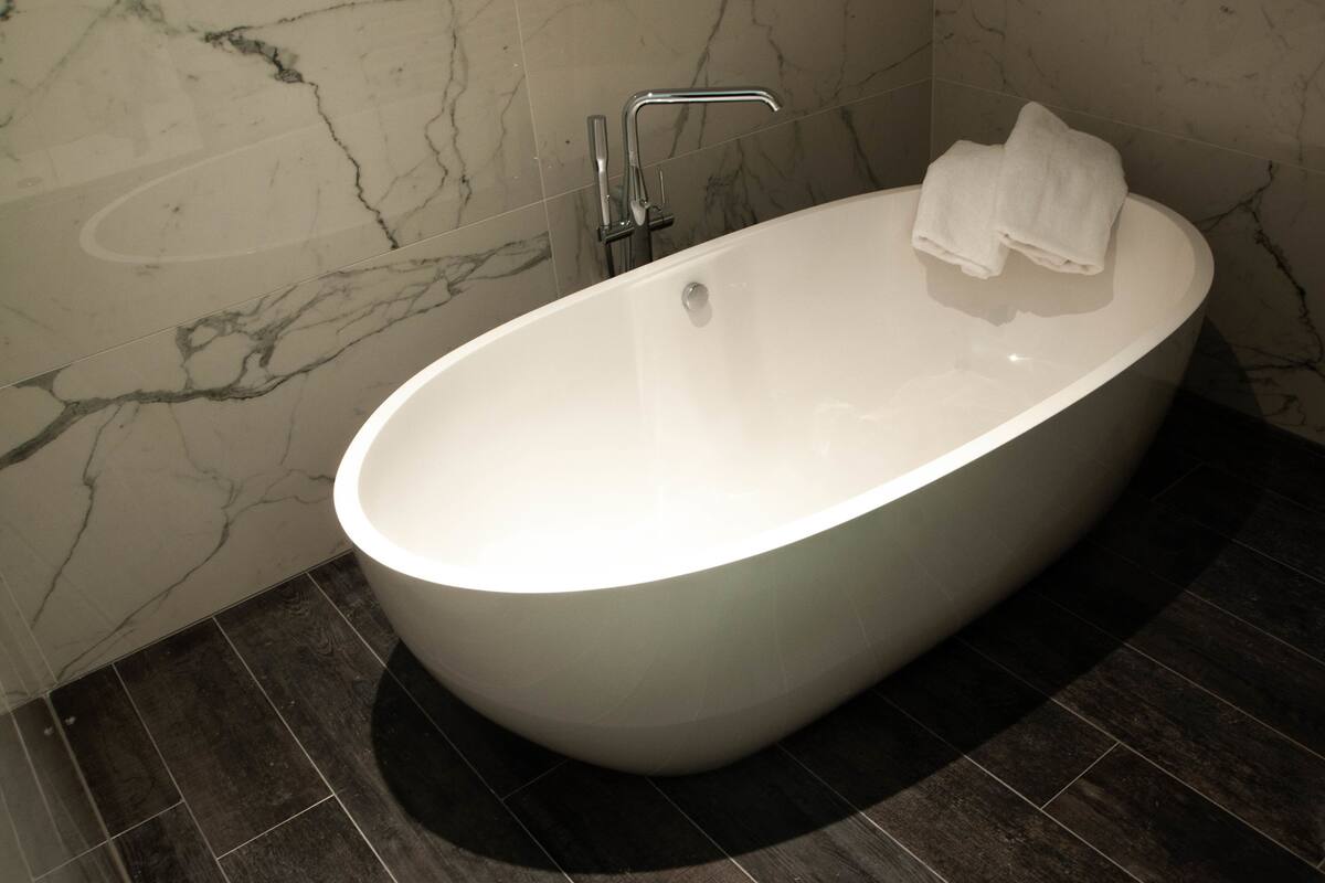 superior quadruple room | bathroom | deep-soaking bathtub, rainfall showerhead, towels