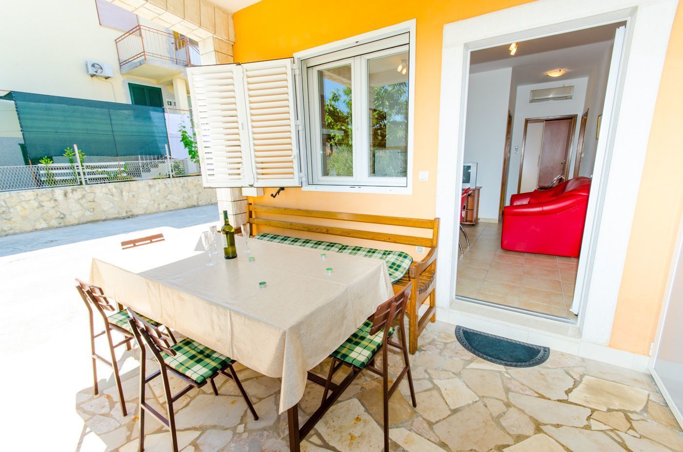 A dining area with a table, chairs, and a bench.