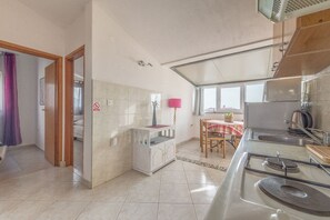 Cozinha privada | Geladeira, micro-ondas, cooktop, máquina de café expresso
