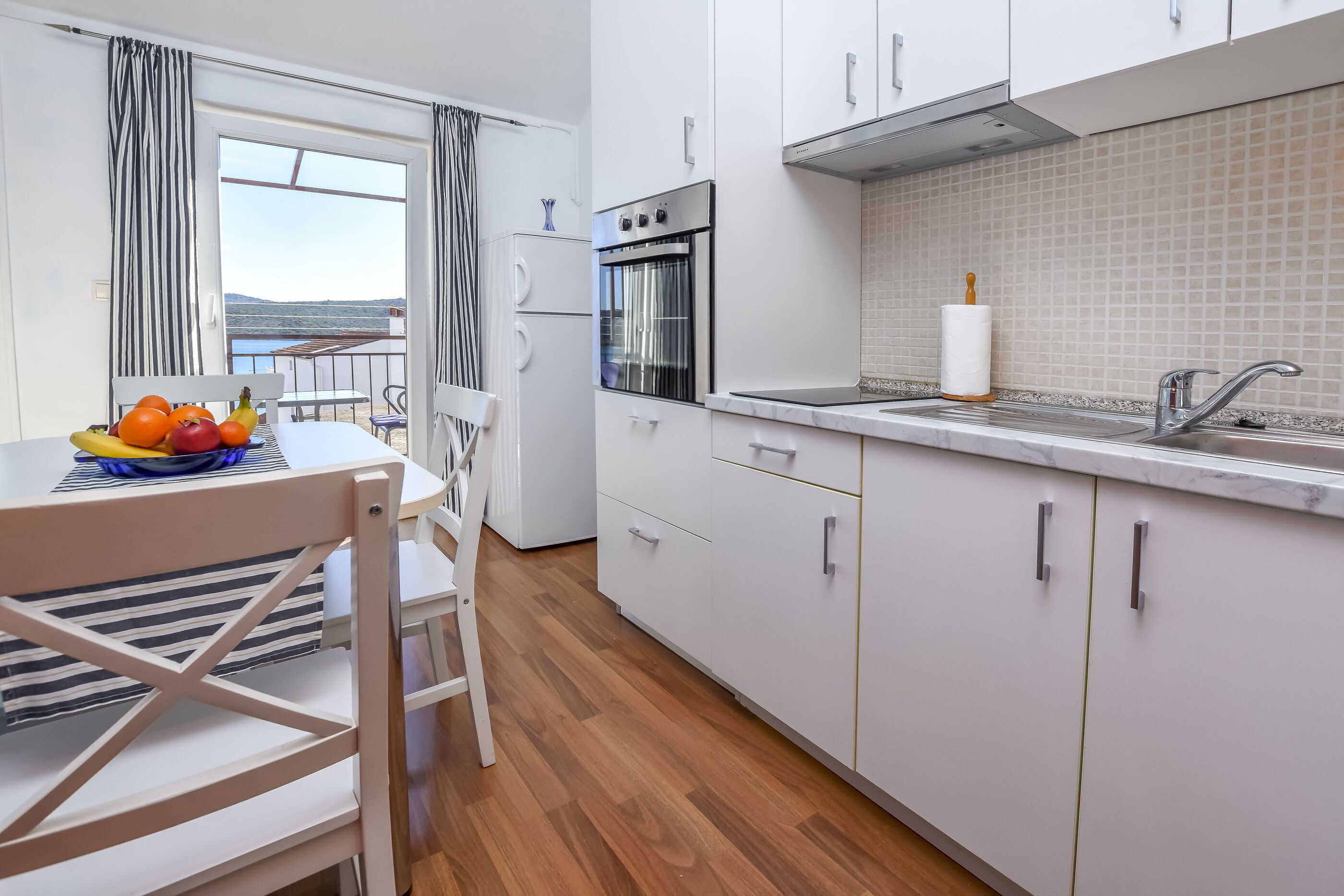 Appartamento (A2) | Cucina privata | Frigorifero, piano cottura, pentole/stoviglie/utensili, freezer