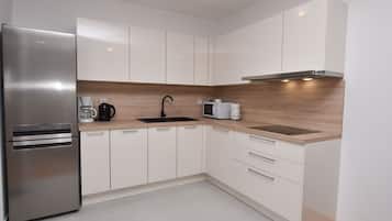 Apartment (A3) | Private kitchen | Fridge, stovetop