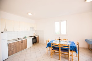 Apartment (A1) | Private kitchen | Fridge, oven, stovetop, espresso maker - Apartments Adriana (Jesenice)