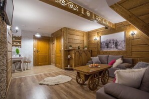 Deluxe Apartment (Debowy) | Living area | Flat-screen TV