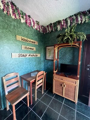 Jungle Grotto Room | Living area | Flat-screen TV - Belize Budget Suites (San Pedro)
