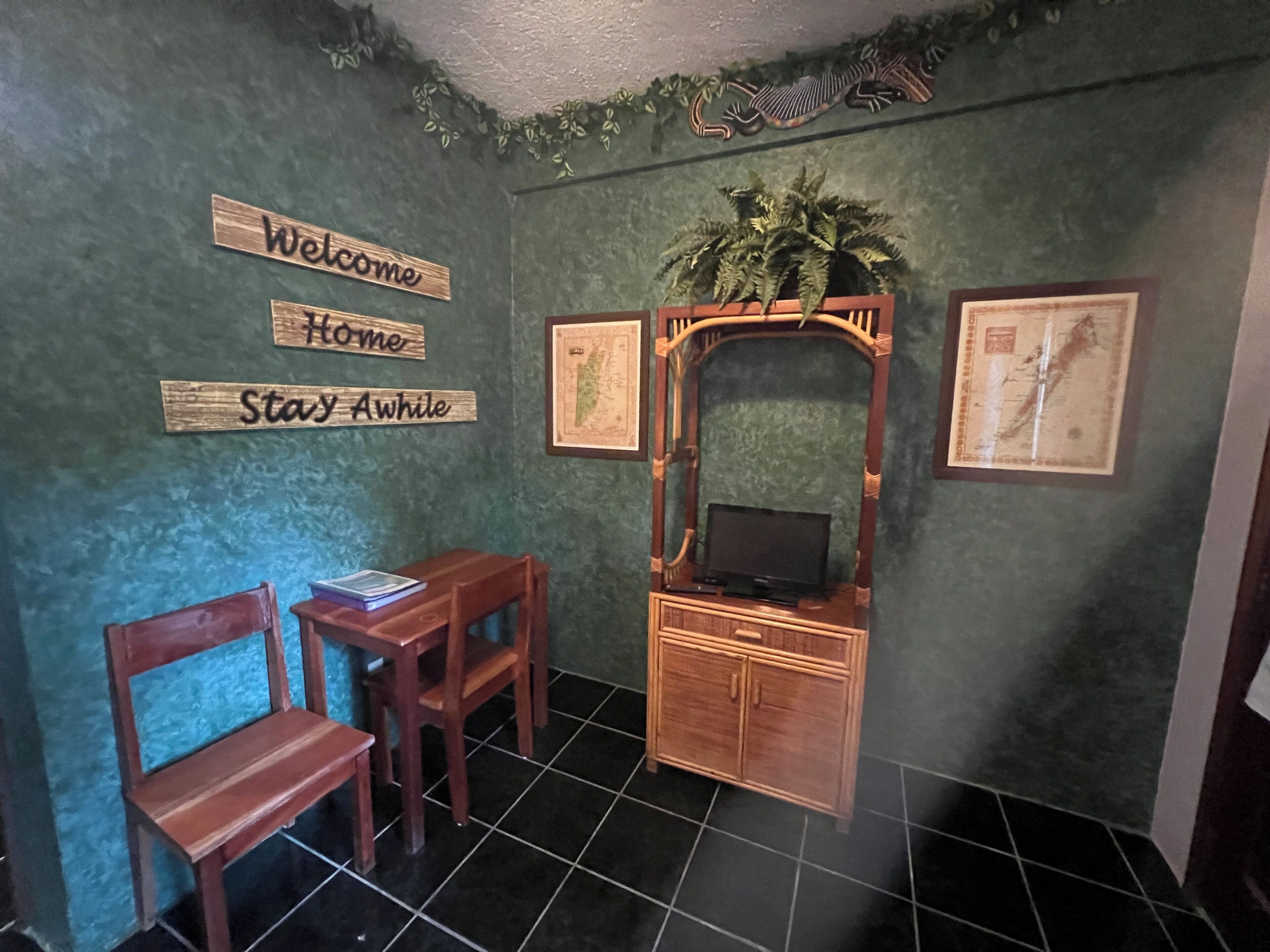 jungle camp room | living area | flat-screen tv