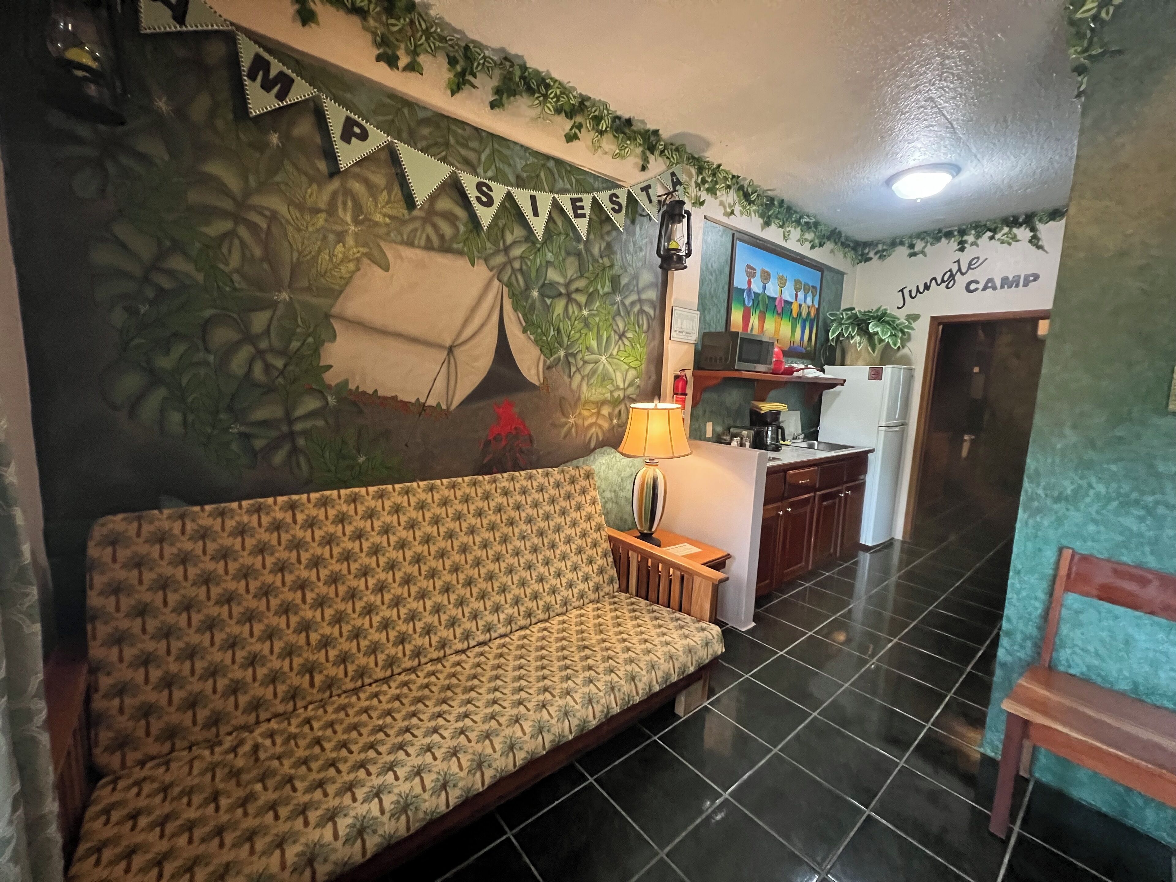 jungle camp room | living area | flat-screen tv