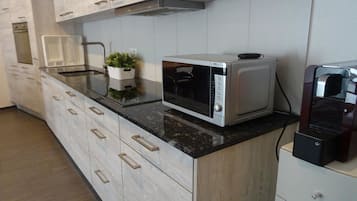 Apartment, 3 Bedrooms | Private kitchen | Full-sized fridge, microwave, oven, stovetop