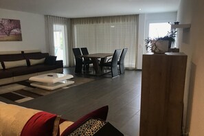 Apartment, 3 Bedrooms | Living room | Flat-screen TV, fireplace, pay films - Bahnhofplatz Apartment (Interlaken)