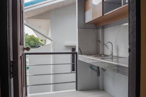 Fridge, microwave, electric kettle, cookware/dishes/utensils