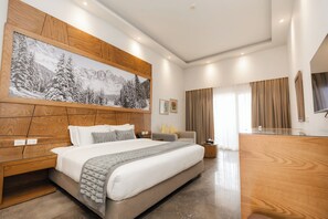 Deluxe Double Room, Pool View | Minibar, in-room safe, iron/ironing board, bed sheets