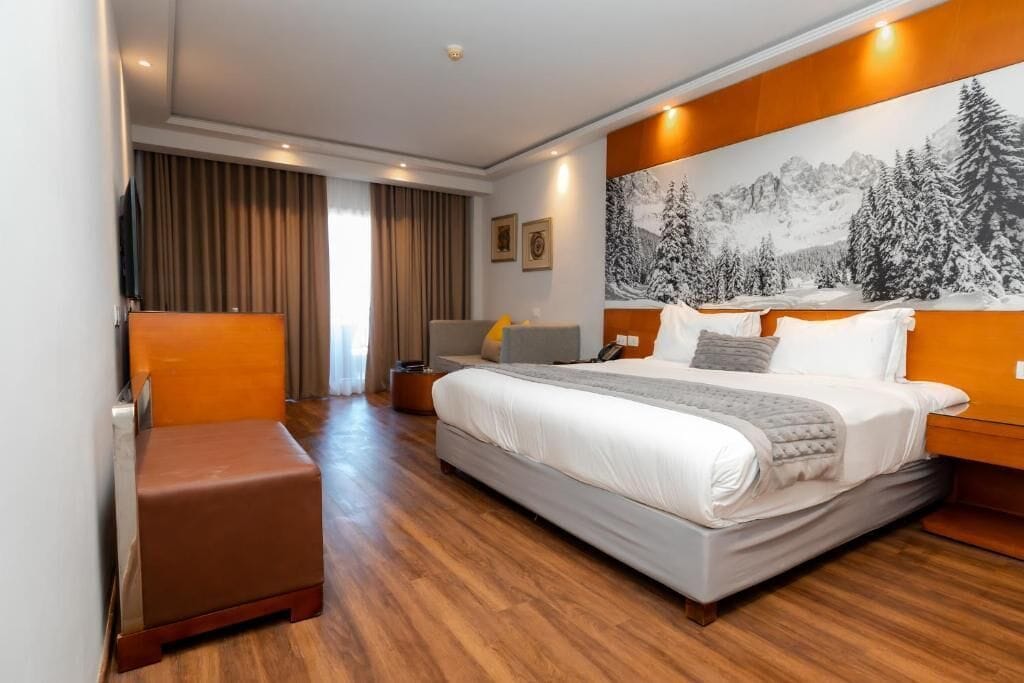 Chambre Double Deluxe, vue mer | Minibar, coffres-forts dans les chambres, fer et planche à repasser