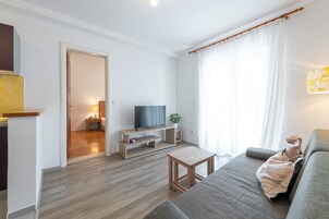 Apartamento, vista para o mar | Área de estar