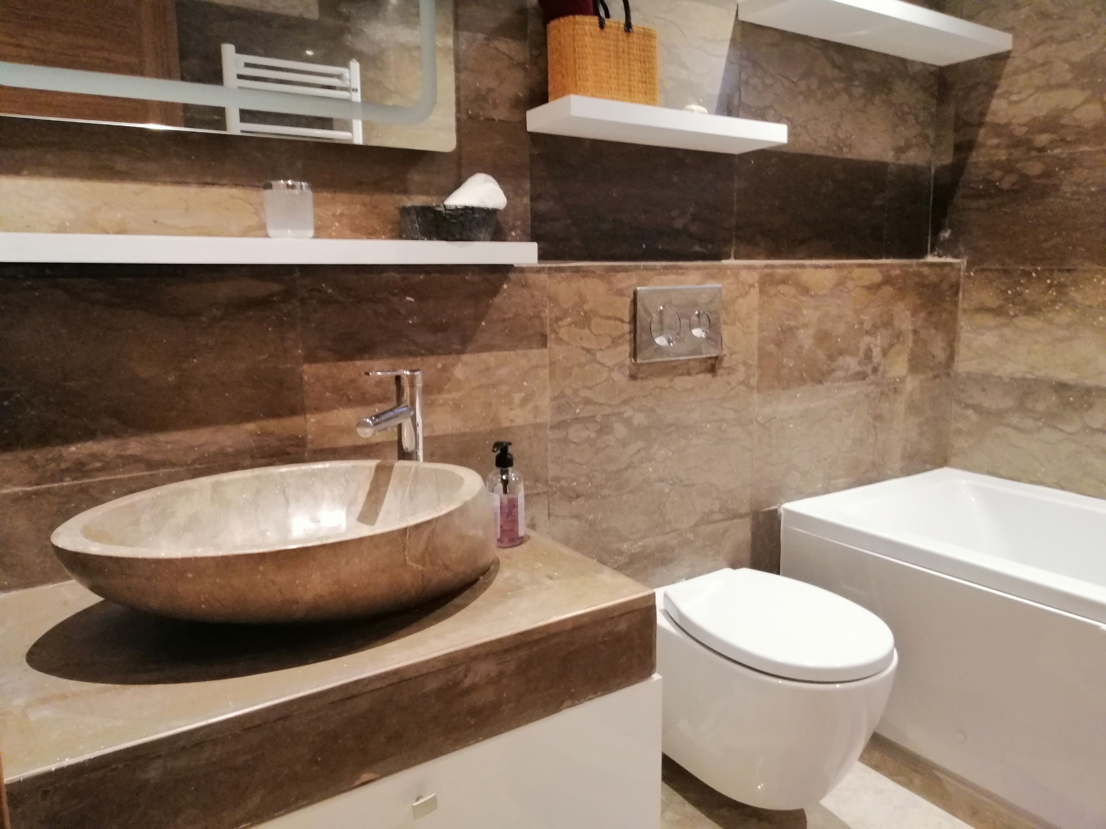 Luxury Apartment | Bathroom | Rainfall showerhead, hair dryer, bidet, towels