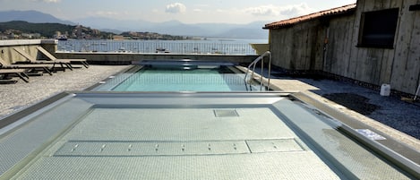 Seasonal outdoor pool, pool loungers