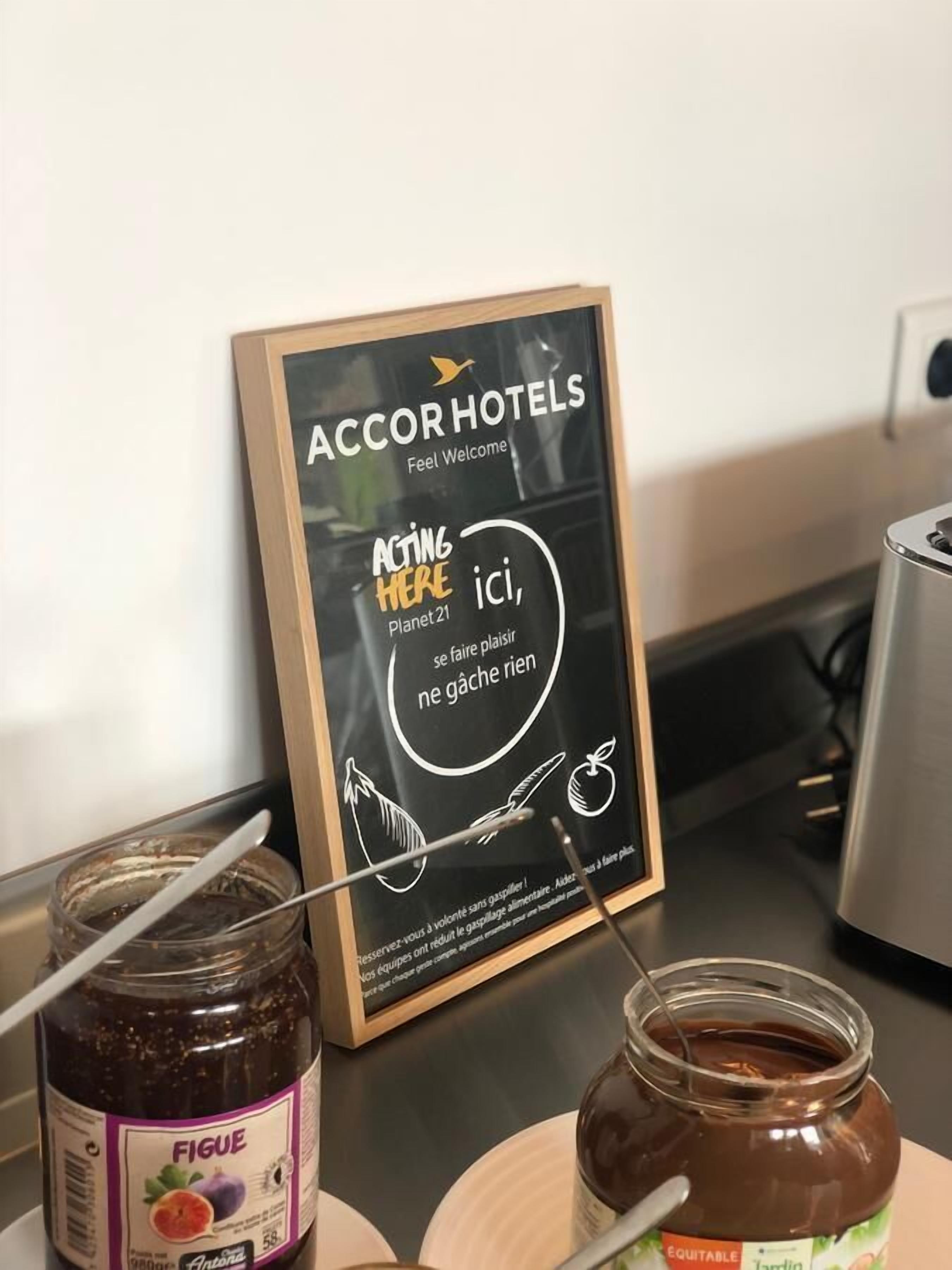 A signboard with 'AccorHotels' branding and a slogan 'Feel Welcome'.
