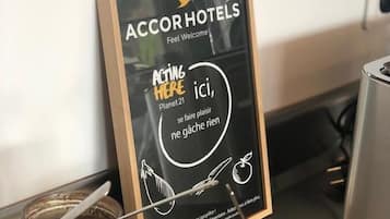 A signboard with 'AccorHotels' branding and a slogan 'Feel Welcome'.