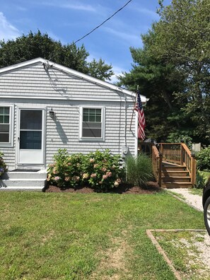 Stroll up to this charming single-story home with a gabled roof and inviting front porch.