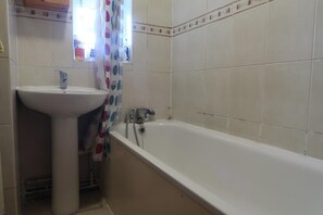 Habitación doble Deluxe | Baño | Regadera y toallas
