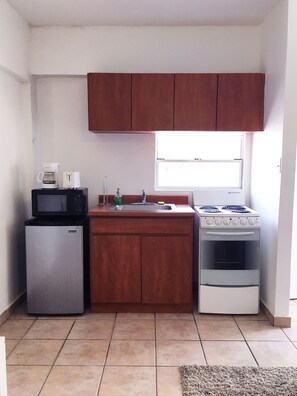 Fridge, microwave, stovetop, coffee/tea maker