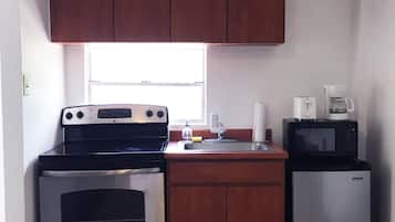 Fridge, microwave, stovetop, coffee/tea maker