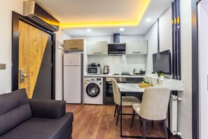 Standard Suite, Ground Floor | Private kitchen | Full-size fridge, microwave, oven, stovetop