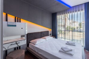 Standard Suite, Ground Floor | Blackout drapes, iron/ironing board, free cribs/infant beds, free WiFi