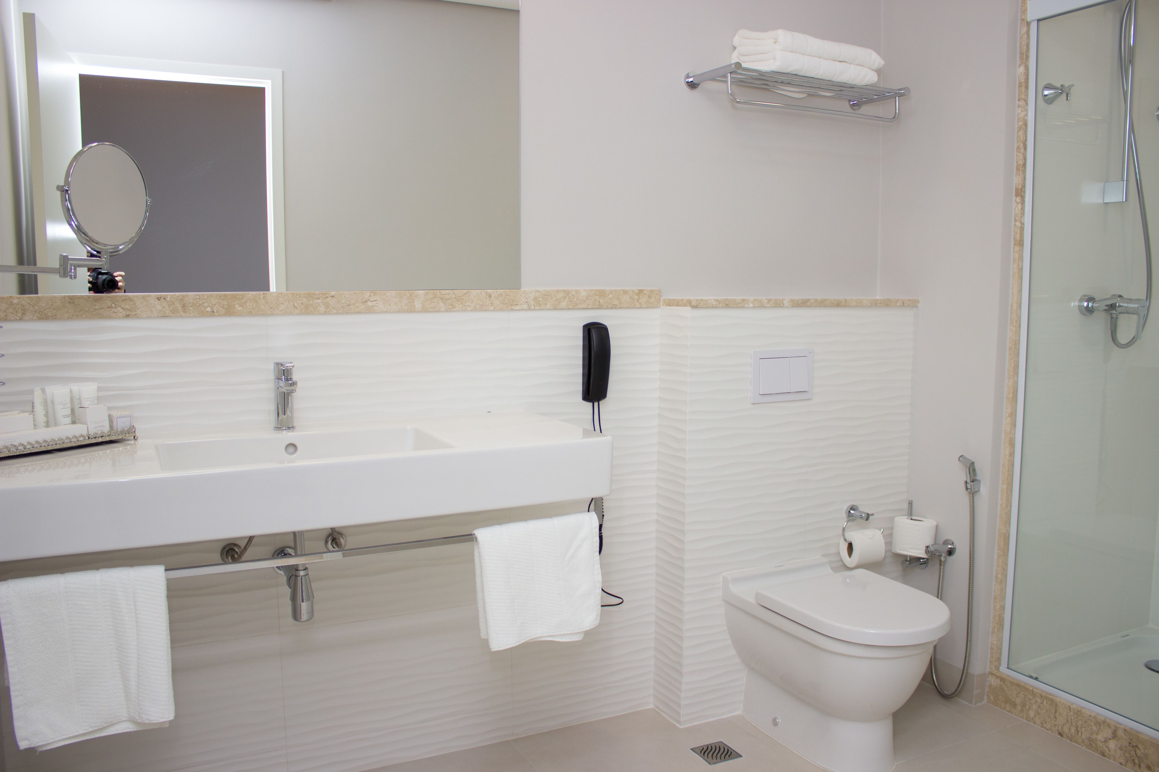 deluxe suite | bathroom | designer toiletries, hair dryer, towels, soap