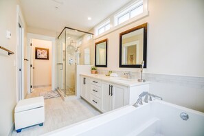 Combined shower/tub, hair dryer, towels, soap