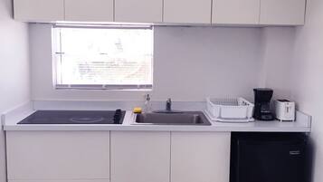 Fridge, microwave, stovetop, coffee/tea maker