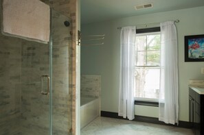 Combined shower/tub, hair dryer, towels, soap