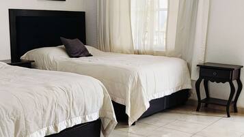 Basic Double Room, 2 Queen Beds, Balcony, Garden View | Down comforters, individually decorated, individually furnished