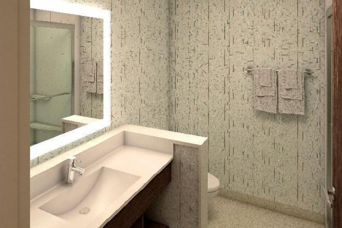 A bathroom with a sink, mirror, and towel rack.
