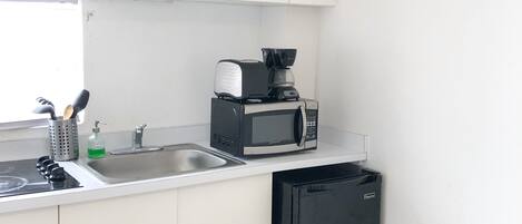 Fridge, microwave, stovetop, coffee/tea maker