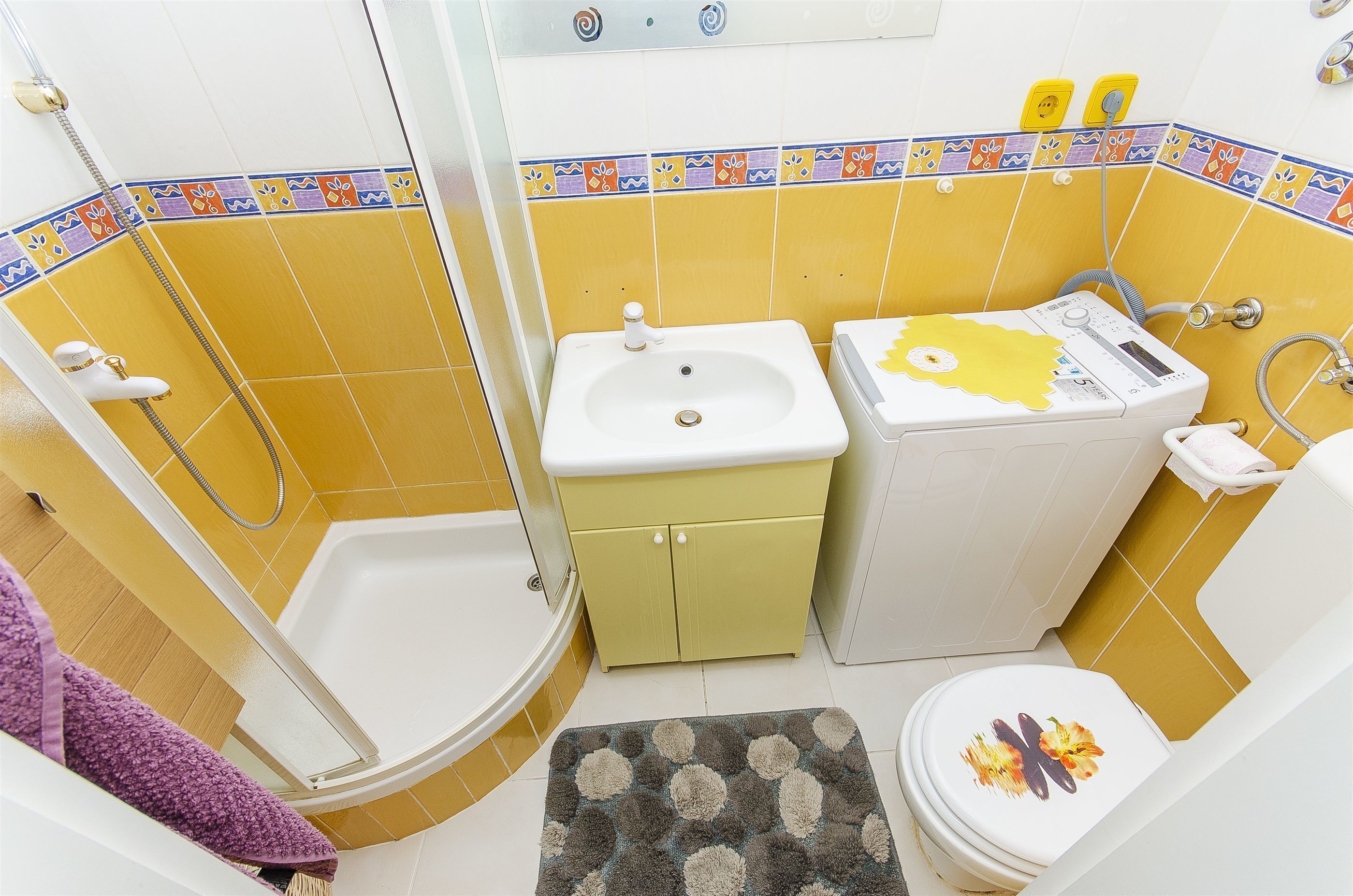 A bathroom with a bathtub, a sink, and a toilet.