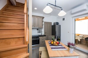 Enjoy meals in the kitchen with a central island and dining area view.