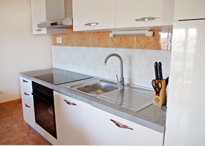 Apartment (A2) | Private kitchen | Fridge, stovetop, electric kettle, cookware/dishes/utensils